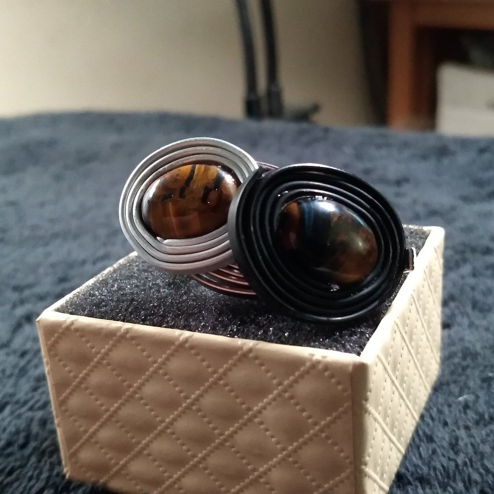 Future fashion swirls of tiger's eyes pair set in rolled aluminum black ring